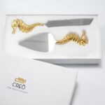 Cake cutter inspired by seahorse in brass and stainless steel is the ideal cutlery set for giting or cake cutting. Order the Prata Cake Knife Set for delivery.